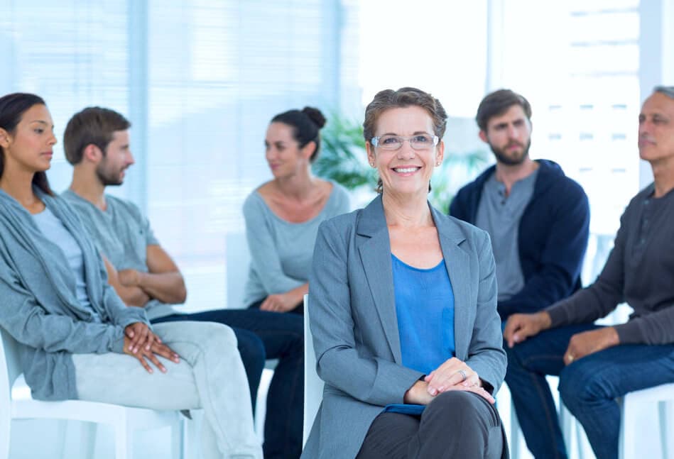 therapist smiling infront of the patient