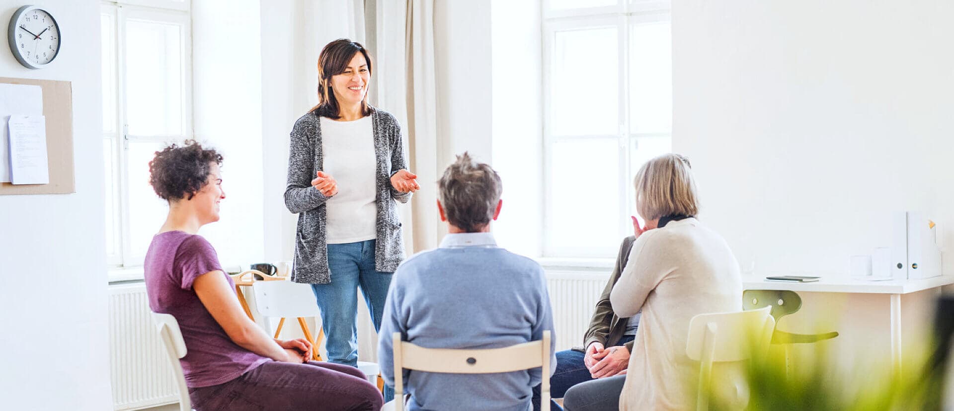 woman talking in the middle of the group