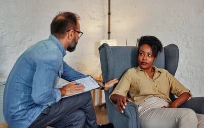 male therapist talking to the patient
