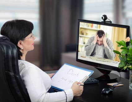 therapist talking the patient via virtual