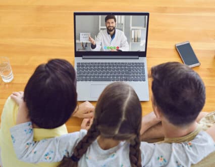 group of people talking to the therapist in the laptop