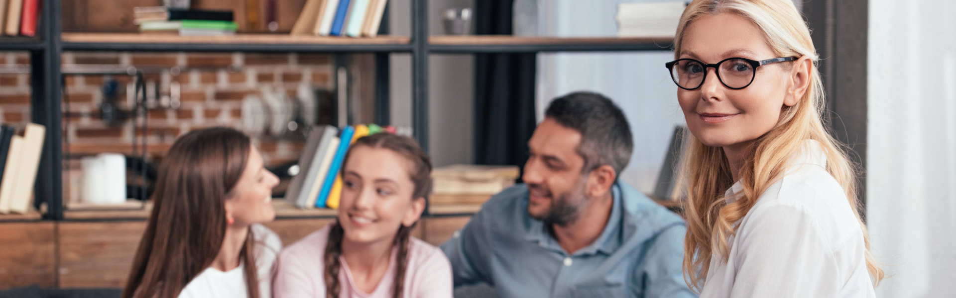 therapist smiling with the patient's family